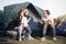 Child singing with family on camping