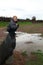 Child siting on stone in viking village