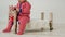 Child sits on a small wooden bed