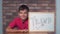 Child sitting at the desk holding flipchart with lettering trend