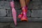 Child sitting with legs in rubber boots holding a umbrella