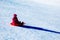 Child Sledding Down Snowy Hill
