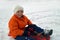 Child sledging in winter