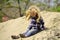 Child slide from pile of sand on idyllic day