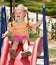 Child on slide in playground.Outdoor park.