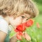 Child smelling tulip