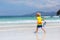 Child snorkeling on tropical beach. Kids snorkel