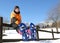 Child with snowshoes in the mountains