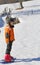 Child with snowshoes in the mountains