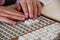 Child solving crossword on Braille alphabet