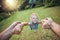 Child spinning from hands in park, pov and happy summer evening. Fun time, motion and girl in garden swinging from arms