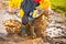 Child splashing in muddy puddle