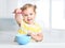 Child with spoon and bowl,girl eating.Kid`s nutrition