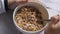 child spoon pick granola Musli in a bowl,