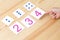 The child spreads cards with numbers to cards with dots. The study of numbers and mathematics