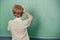 Child standing in class in front