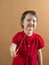 Child stretching a chewing gum from her mouth