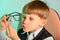 The child studies the gem through glasses, the concept of children, business, jewelry