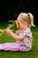 Child with sunflowers in the garden in summer