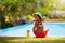 Child with sunscreen at swimming pool