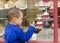 Child at sweet cake shop