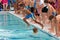 Child Swimmer Jumps Into Pool To Swim Relay Race