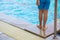 Child swimmer standing pool side. concept of Drowning