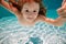 Child swimming underwater. Kid swim under water in pool.