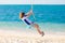 Child on swing. Kid swinging on beach