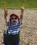 Child Swinging in Bucket Seat