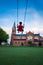 Child swinging high against the Sint Lambertus Church, Leuven