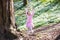 Child swinging on tree rope swing