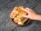 The child takes his right hand sausage dough from a clay bowl