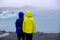 Child, taking picture at early evening on a rainy day at picturesque iceberg lagoon Jokursarlon