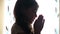 Child teen girl praying prays silhouette in the