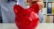 Child throws coin piggy bank and children savings. Concept of saving and investing money