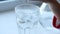 A child throws a soluble aspirin tablet in a glass of water