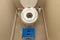 A child toilet seat attachment placed on top of a toilet for a kid during potty training