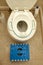 A child toilet seat attachment placed on top of a toilet for a kid during potty training