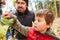 Child touches the leaf of an oak tree during the tree study lesson