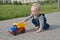 Child with a toy truck