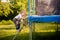 Child on trampoline ladder