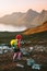Child traveler hiking with backpack in mountains active travel vacations in Norway outdoor family healthy lifestyle