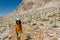 child travels in the mountains with a backpack. mountain hike in high mountains. Turkey