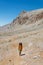 child travels in the mountains with a backpack. mountain hike in high mountains. Turkey