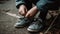 A child tying the laces on their school shoes before heading off to class