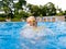 Child underwater in swimming pool. Kids swim