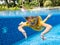 Child underwater in swimming pool. Kids swim