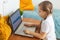 Child using laptop at home. Distance learning and on-line education concept