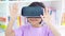 Child using virtual reality goggles in library